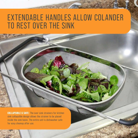 6-Quart Over The Sink Stainless Steel Colander With Expandable Rubber Handles filled with fresh salad, resting above kitchen sink.
