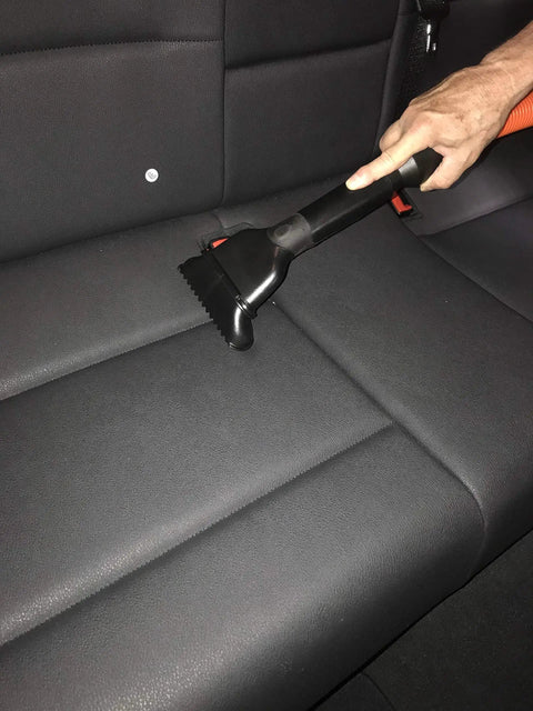 Using Central Vacuum Garage Attachment Kit With 50 Ft Hose, Crush Proof Pro Grade, tool on car seat.