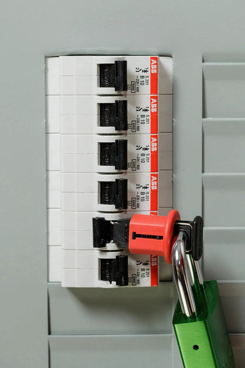 Miniature Circuit Breaker Lockout Pin-Out, Standard DIN Style on electrical panel, for 120/277 VAC European machinery, red lock engaged.