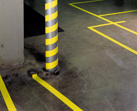 Vinyl Floor Marking & Protective Tape, High-Visibility Yellow, 1/4 in x 36 yd installed on warehouse floor and pole