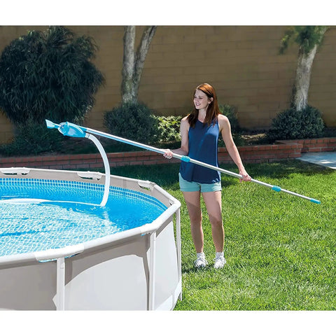 Woman using Deluxe Above Ground Pool Maintenance Kit With Vacuum For 800 GPH Flow Rate 110 Inch Telescoping Pole Wall Brush cleaning pool
