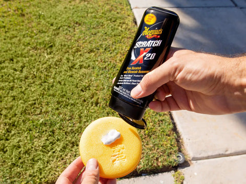 Car Scratch Fix That Kicks Out Paint Scratches and Swirls Without Messing Your Clear Coat Meguiars ScratchX 7 Oz Liquid applied to a foam applicator.