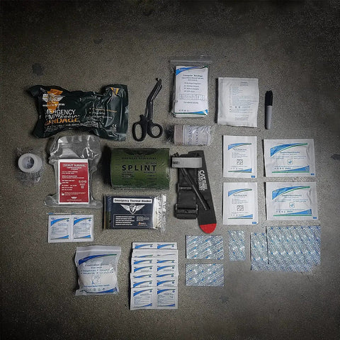 Emergency Trauma Kit With CAT Gen 7 Tourniquet And 36 Inch Splint For Outdoor Adventures Camping Hiking And Survival IFAK laid out