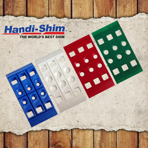 Heavy Duty Reusable Plastic Construction Shims For Spacing And Leveling Great For DIY Projects And Plumbing 40 Piece Pack One Eighth Inch White Handi Shim in blue, red, and green colours on wood background.