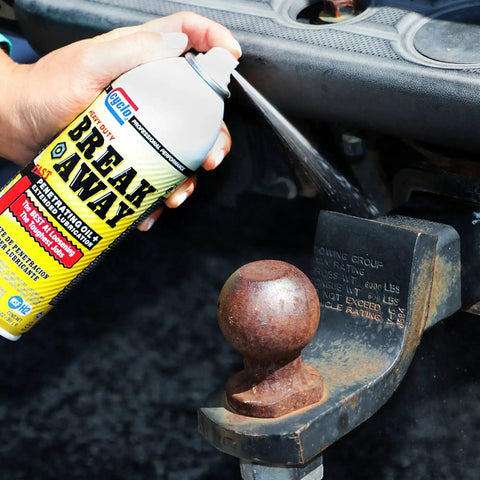 Applying heavy duty breakaway penetrating oil for loosening rusted joints and bolts, fast acting lubricant, 13 oz can