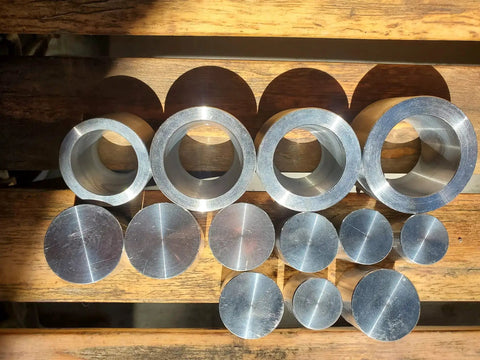 Coin Ring Punch And Spacer Set For Jewelry Making Tools With Self Centering Punch Hole Punch Coin Ring Die Wraps And Swedish Wrap Method includes die and rod set on wood table