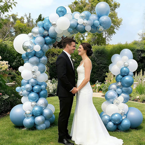 Wedding couple under Bendable Balloon Arch Stand Kit 9ft And 5.6ft With Heavy Base Water Bag Gold in garden setting.
