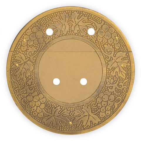 Circular brass decorative plate with intricate floral design, featuring holes for easy mounting.