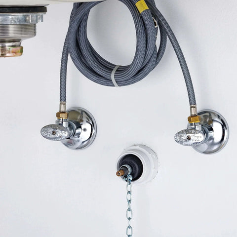 Cherne 1-1/4 In To 1-1/2 In Test Ball Plug for DWV systems installed beneath a sink with hoses and valves visible