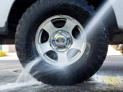 Fast Acting All Wheel Cleaner That Destroys Brake Dust, Turns Purple While Dissolving Grime, Safe For All Wheel Finishes And Brakes, Acid Free And PH Balanced Meguiars applied to a silver alloy wheel while rinsing.