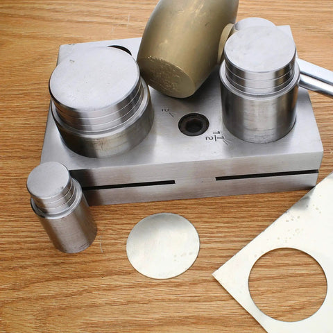 Pro Grade Circle Disc Cutter Set with four punches and die on wooden surface, includes 1, 1-1/4, 1-1/2, and 2 inch sizes.