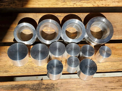 Coin Ring Punch And Spacer Set For Jewelry Making Tools With Self Centering Punch Hole Punch Coin Ring Die Wraps And Swedish Wrap Method Includes Four Die Wraps And Nine Push Rods Made In USA displayed on wooden surface