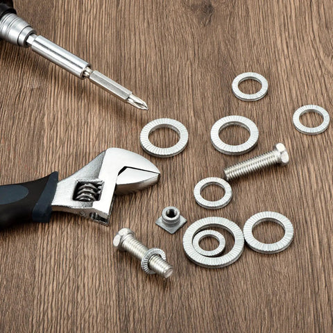 Uxcell wedge locking washers for M5 bolts, 20 pcs, manganese steel, serrated outer edge, top-down view on wood