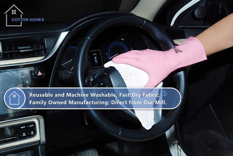 Person using Tough As Nails Cotton Shop Towels 12x14 Inches Pack Of 50 Plus 5 Bonus Reusable Cleaning Rags in a car interior