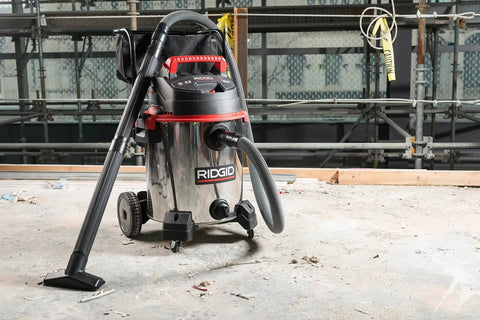16-Gallon Stainless Steel Wet Dry Shop Vacuum With Cart, Pro Hose, Drain And Blower Port, 6.5 Peak HP Motor on concrete floor