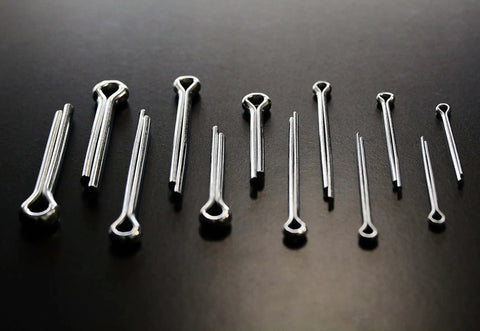 144 Piece Cotter Pin Set With 6 Popular Sizes Spring Steel Zinc Plated For Rust Resistance spread on black surface.