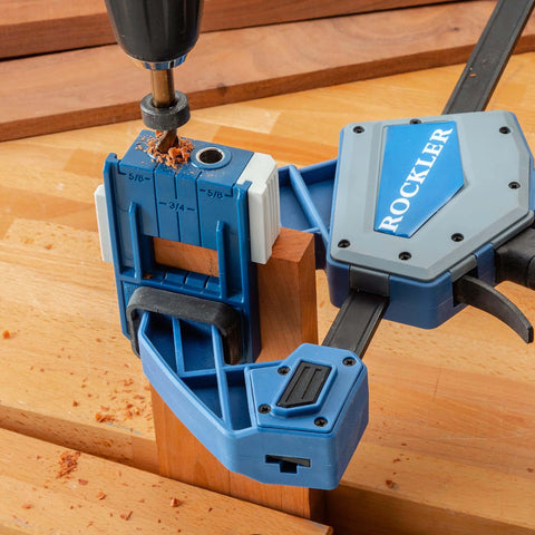 One Half Inch Doweling Jig Kit With Drill Bit And Stop Collar For Rock Solid Joints End Or Edge Reference Stops For Flush Faces Easy Repeatable Precision On Cabinets And Furniture Making in use on wooden surface