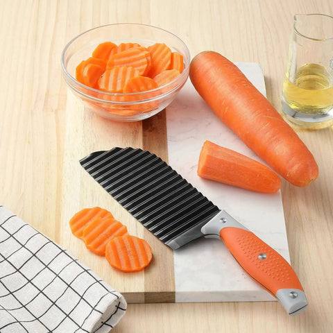 Crinkle Cut Knife For Veggies And Fries With Stainless Steel Wave Blade And Ergonomic Handle VITUER next to sliced carrots on board