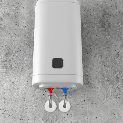 White wall-mounted water heater with red and blue supply lines on a concrete wall.