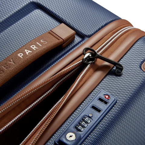 Close-up of the Chatelet Air 2.0 Hardside Luggage Trunk with Spinner Wheels navy blue 26 inch durable polycarbonate shell zipper and lock.