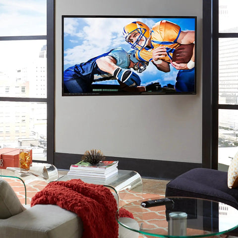 TV displaying football game in living room, mounted using TV Mount Lag Bolt Kit For Wood Or Concrete With Heavy Duty Bolts Fischer Anchors And Drill Bits No Fuss Remount For Your TV Fast And Easy Without Replacing The Mount.