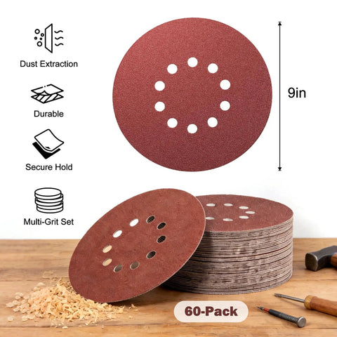 9 Inch Hook And Loop Drywall Discs Set 60 Pieces 10 Holes 40 To 240 Grits, stacked on a wooden table with tools.
