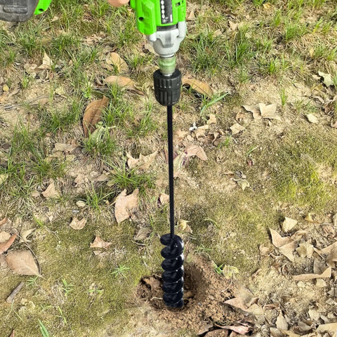 32 Inch Long Handle Garden Auger Drill Bit For Planting Workhorse With Three Eighth Inch Hex Drive Easy Planter in use on grass