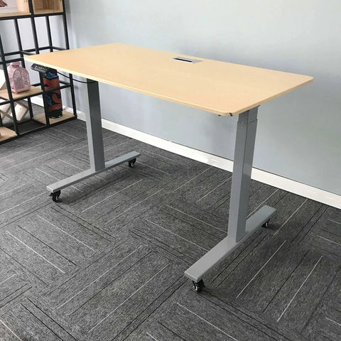 Standing desk with 2 Inch M8 Threaded PU Swivel Casters Set Of 4 With Brakes, installed on gray carpet, showcasing mobility feature.