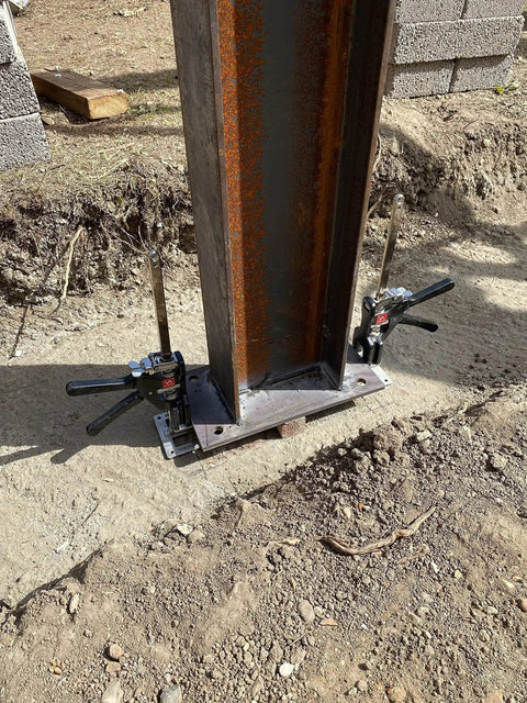 Original Handheld Jack and Clamp for One Hand Lifting Up to 330 Lbs installed on steel beam at construction site