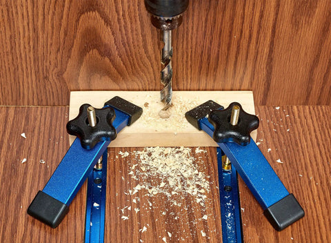 Two 24 Inch Aluminum T Track Set With Hold Down Clamps For Woodworking installed, showing use on router table with blue anodized finish