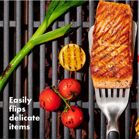 Grilling Tool Precision Turner For Effortless Burger Flips And Flaky Fish Fillets With Thin Beveled Head Non Slip Grip And Hanging Ring OXO Good Grips Black used on grill with fish fillet