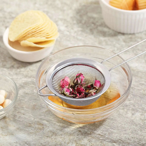 Ultra Fine Mesh Strainer With Handle Stainless Steel Kitchen Sieve 3.35 Inch Small Filter in action with rose petals in a glass bowl