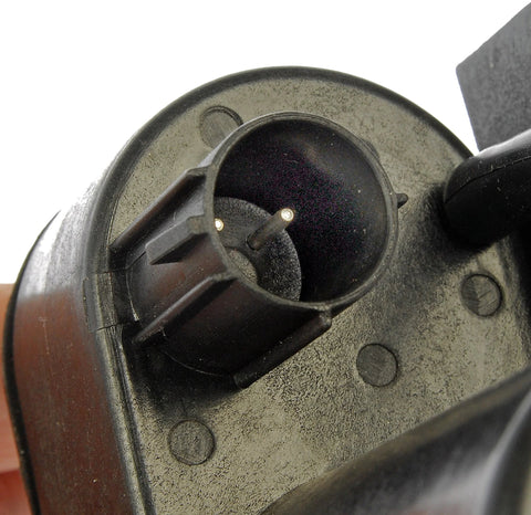 Vacuum pump component, black plastic housing with circular inlet and two metal pins visible, for Dodge/Ford