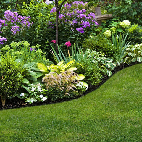 Pound-In Lawn Edging With Bonus Anchoring Stakes for Easy DIY Landscape Border, 4.5 Inch Straight-Top Plastic Garden Border Kit, 20 Foot Black, installed around garden beds