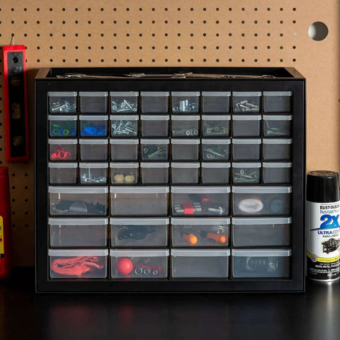 Small Parts Storage Cabinet With 44 Drawer Organizer For Screws Nuts Bolts Electronics Hardware Beads Crafts And More, Built Tough Made In USA Stackable Black Boss Grade on a workbench.