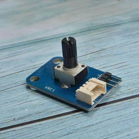 Close-up of 10K Ohm rotary potentiometer module for Arduino with 3 pin and Grove 4 pin interface on blue circuit board.
