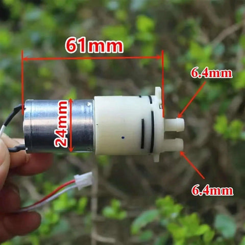 Compact DC 6V 9V 12V Micro 370 Motor Self Priming Diaphragm Water Pump with 24mm diameter and 6.4mm ports, hand-held view
