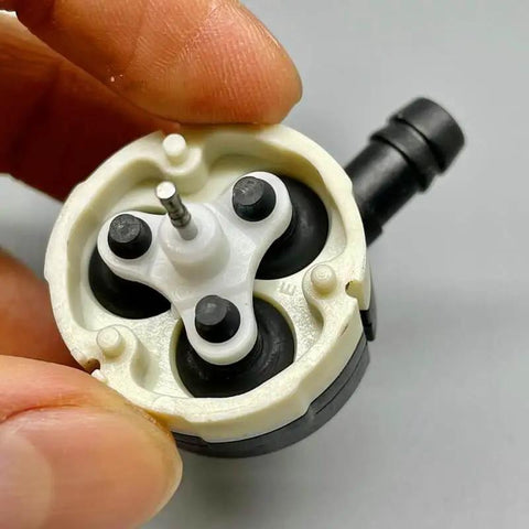 Close-up of Cordless 12V Diaphragm Water Pump With 8mm Orifice Metering Flow showing internal components, compact design.