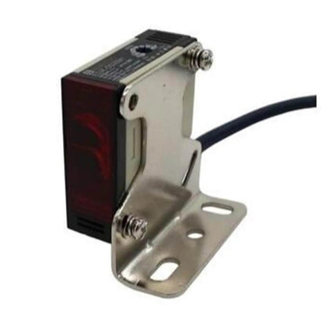 Side view of Diffuse Type Photoelectric Switch E3JK-DS30M1 with metal mounting bracket, designed for AC 90-250V or DC 10-30V sensing in machinery.