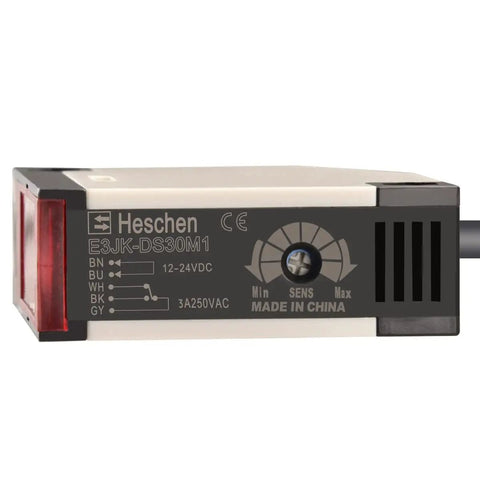 E3JK DS30M1 photoelectric sensor switch, black and beige, 12-24V DC, front view, with sensitivity adjuster and relay output specs.