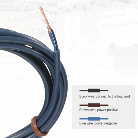 Coiled electrical cable with wiring guide showing black, brown, and blue wires for power connection.