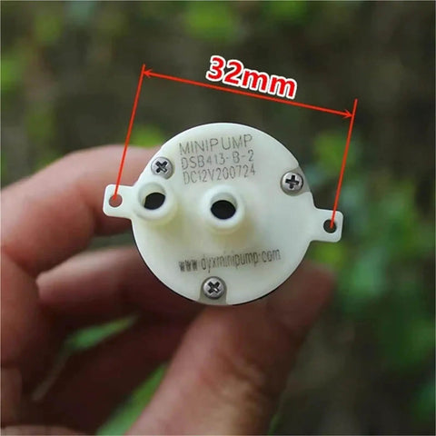 Close-up of Mini Self Priming Diaphragm Water Pump 6V-12V With 370 Micro Motor DSB413-B showing 32mm diameter.