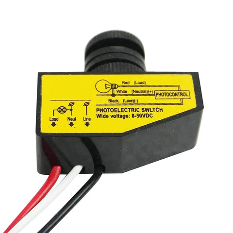 Close-up of Photocell Light Control Switch For Outdoor Lighting Auto On At Dusk Off At Dawn 8V To 50V DC Sensor with three wires