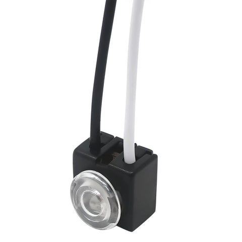 Close-up of Plug And Play No Fuss Easy Install Dusk Till Dawn Photocell Switch for 120V Lighting with two wires and transparent lens
