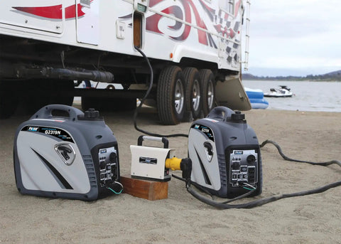 Quiet 2300W Portable Gas Powered Inverter Generator with USB Outlet next to camper trailer on a beach
