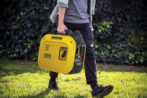 Person carrying Ultralight 2500-Watt Portable Inverter Generator With Quiet Technology And CO Shield for camping, tailgating, home backup