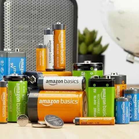 Assorted Amazon Basics batteries, including AAA Alkaline Batteries 12 Pack 1.5V Long Lasting 10 Year Shelf Life For Home Use.