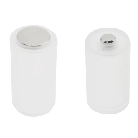 8 Pack AAA To AA Battery Adapters With Metal Contacts On Bottom Transparent, two adapters standing side by side