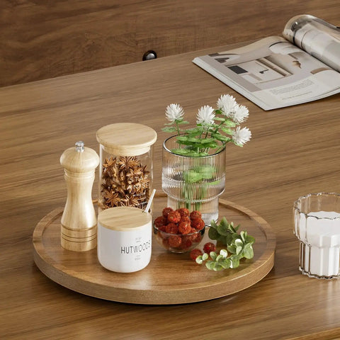 Acacia Wood Lazy Susan Turntable 10 Inch with various condiments and flowers on a wooden tabletop