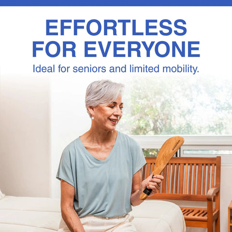 Senior woman holding Bed Sheet Tucker Mattress Lifter Tool Made From Sturdy Acacia Wood That Helps You Change Sheets Without Strain
